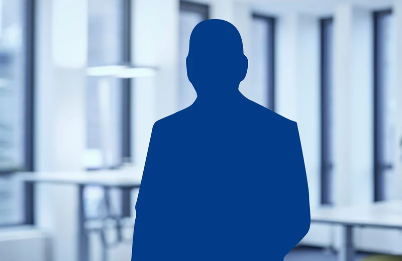 Blaue Silhouette einer Person als Platzhalter für ein Portrait in einem modernen Büro.